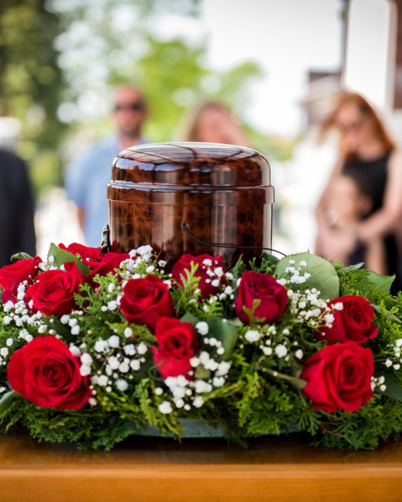 Funerary,Urn,With,Ashes,Of,Dead,And,Flowers,At,Funeral. Funerary,Urn,With,Ashes,Of,Dead,And,Flowers,At,Funeral.